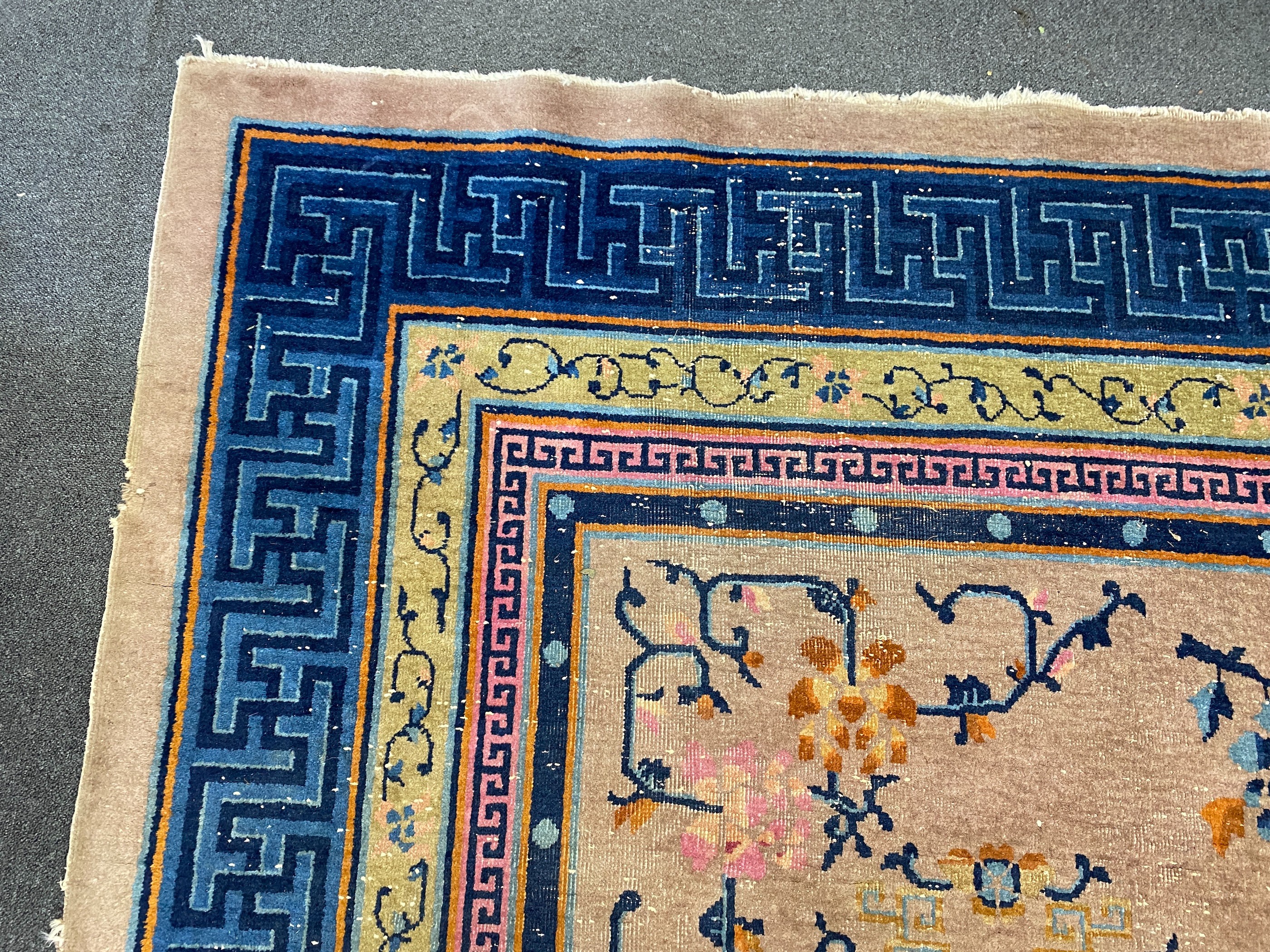 An early 20th century Chinese lilac ground carpet, 330 x 240cm